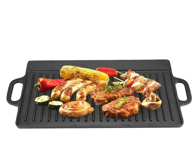 Cast iron grill griddle grill plate showing both flat griddle and ribbed grill sides, ready for cooking.